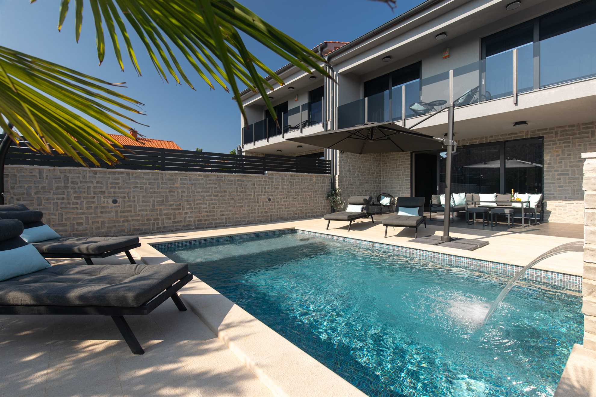 Modern Vila Melia with a pool and sunbeds