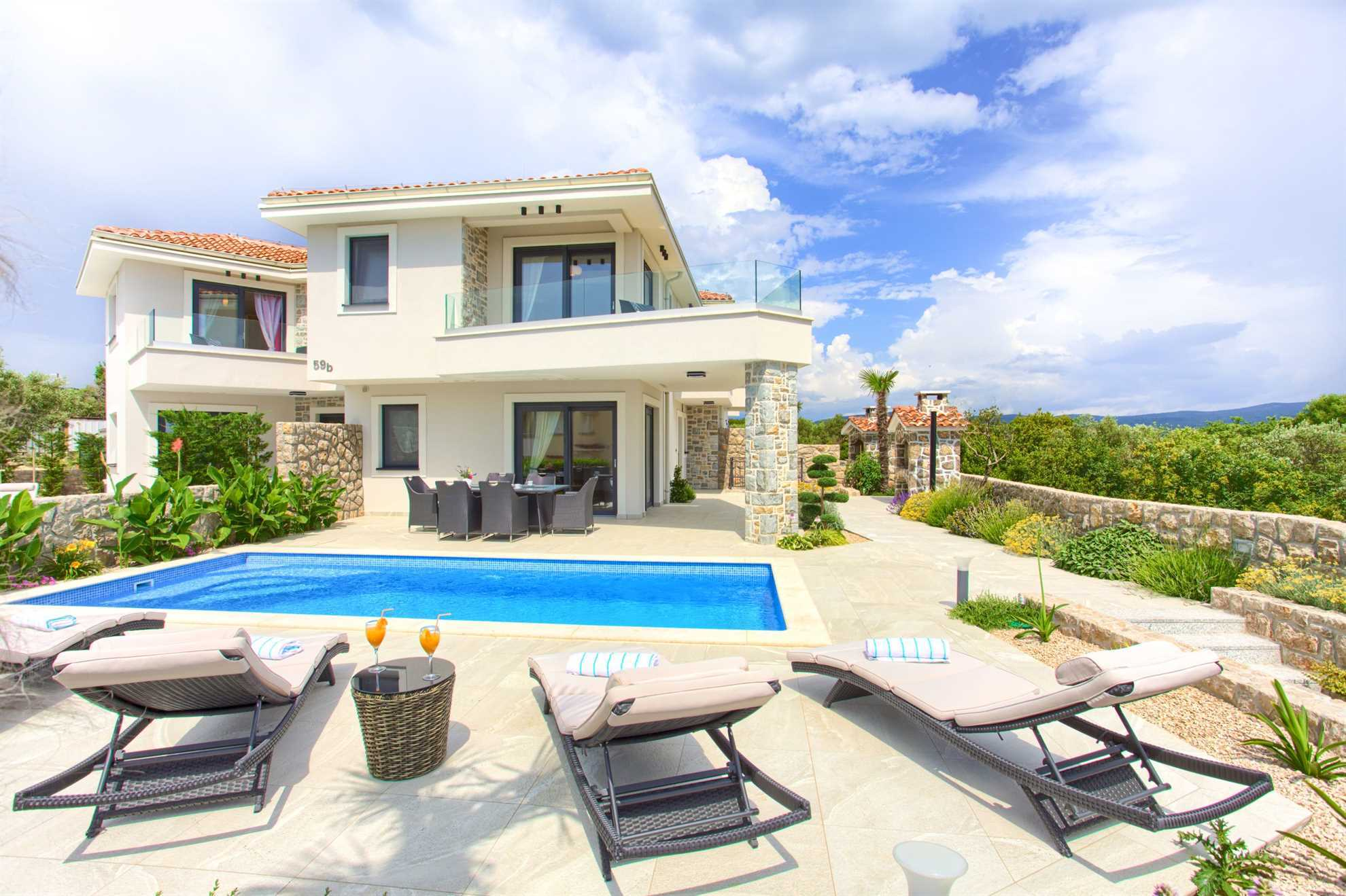Luxury holiday house BELLA with pool, terrace, and a balcony