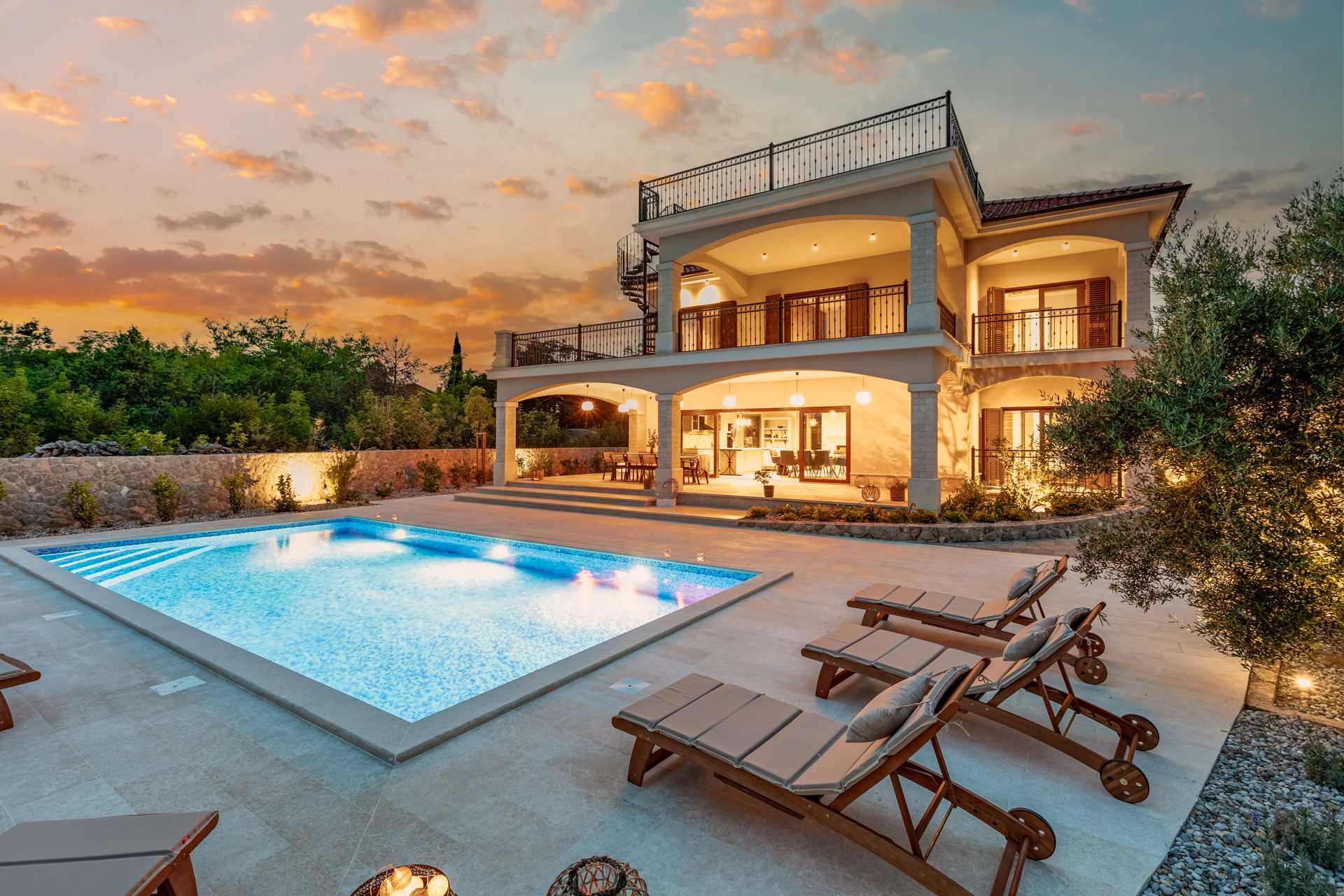 Luxury villa Glabrova with outdoor pool, sun loungers and landscaped yard.