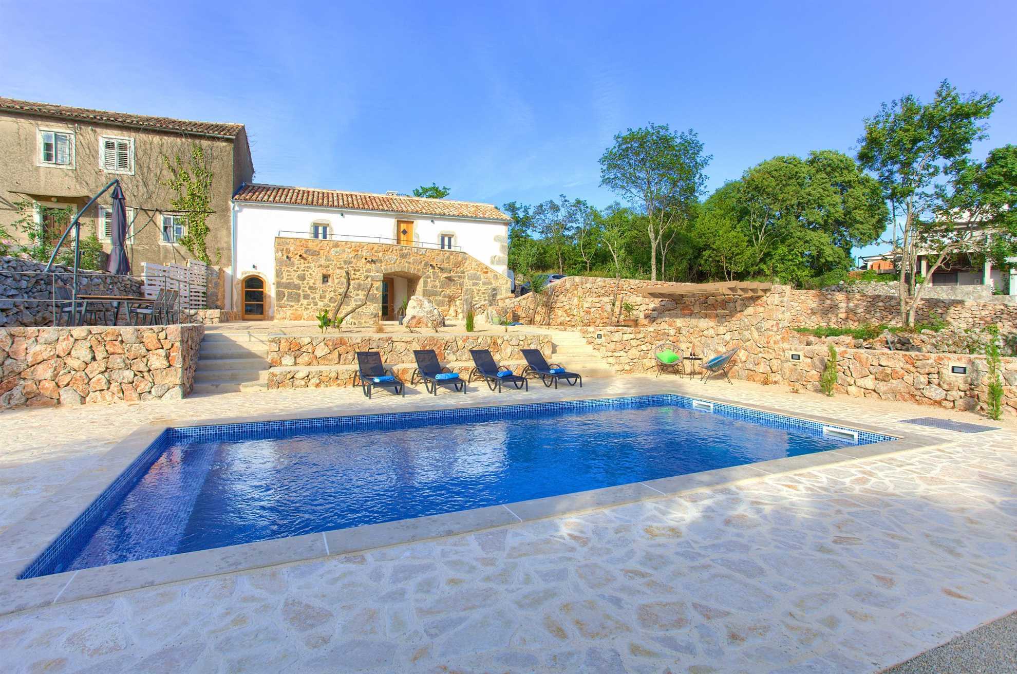 Villa May with a swimming pool.